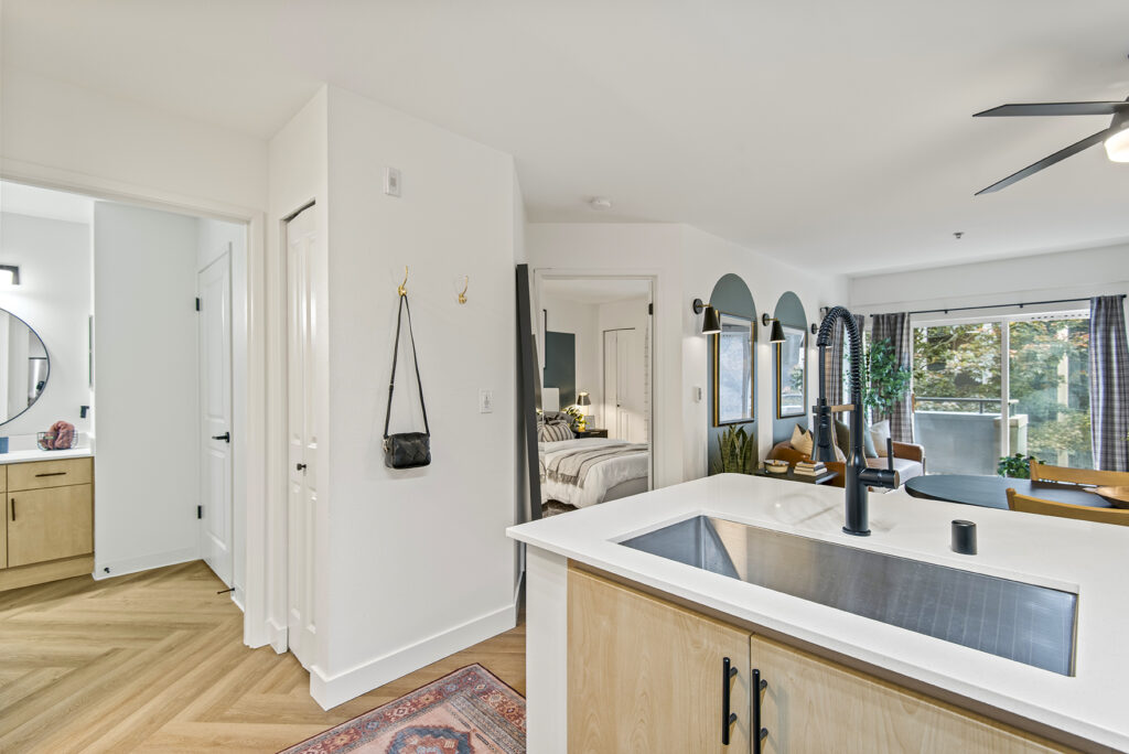 Kitchen with stainless steel sink at Novi at Queen Anne apartments in Seattle, WA