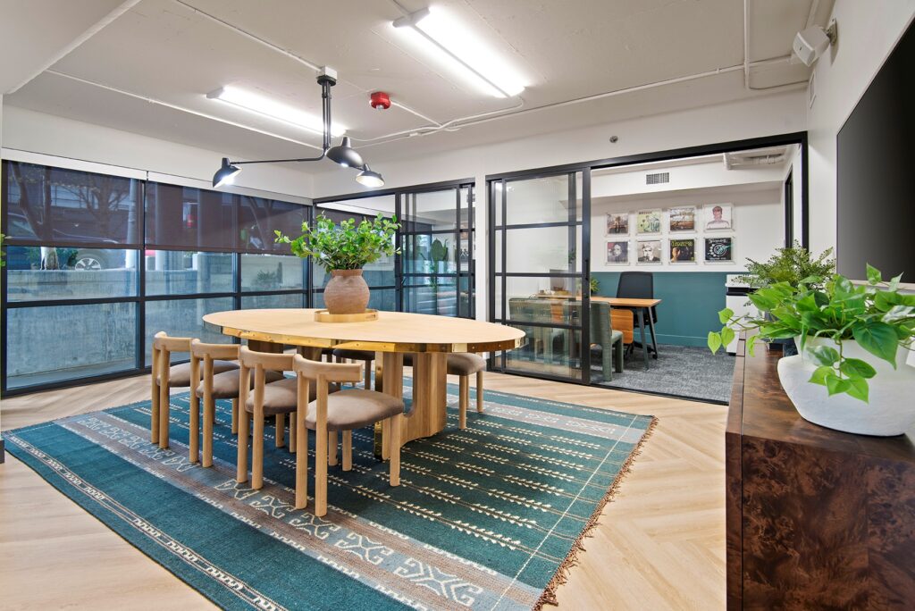 Leasing office with a center table and two offices at the end