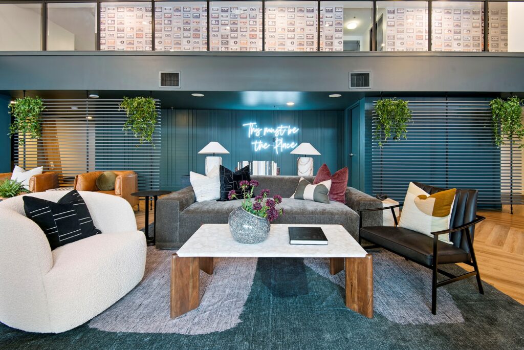 Common area with lounge seating and large windows